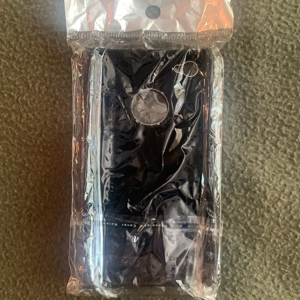 NIP black and silver phone cover and one GUC black and silver phone cover.
